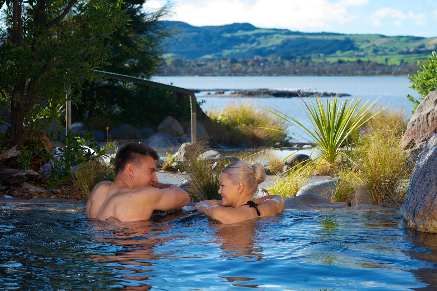 relaxing-in-pool polynesain spa private pool health and wellness rotorua